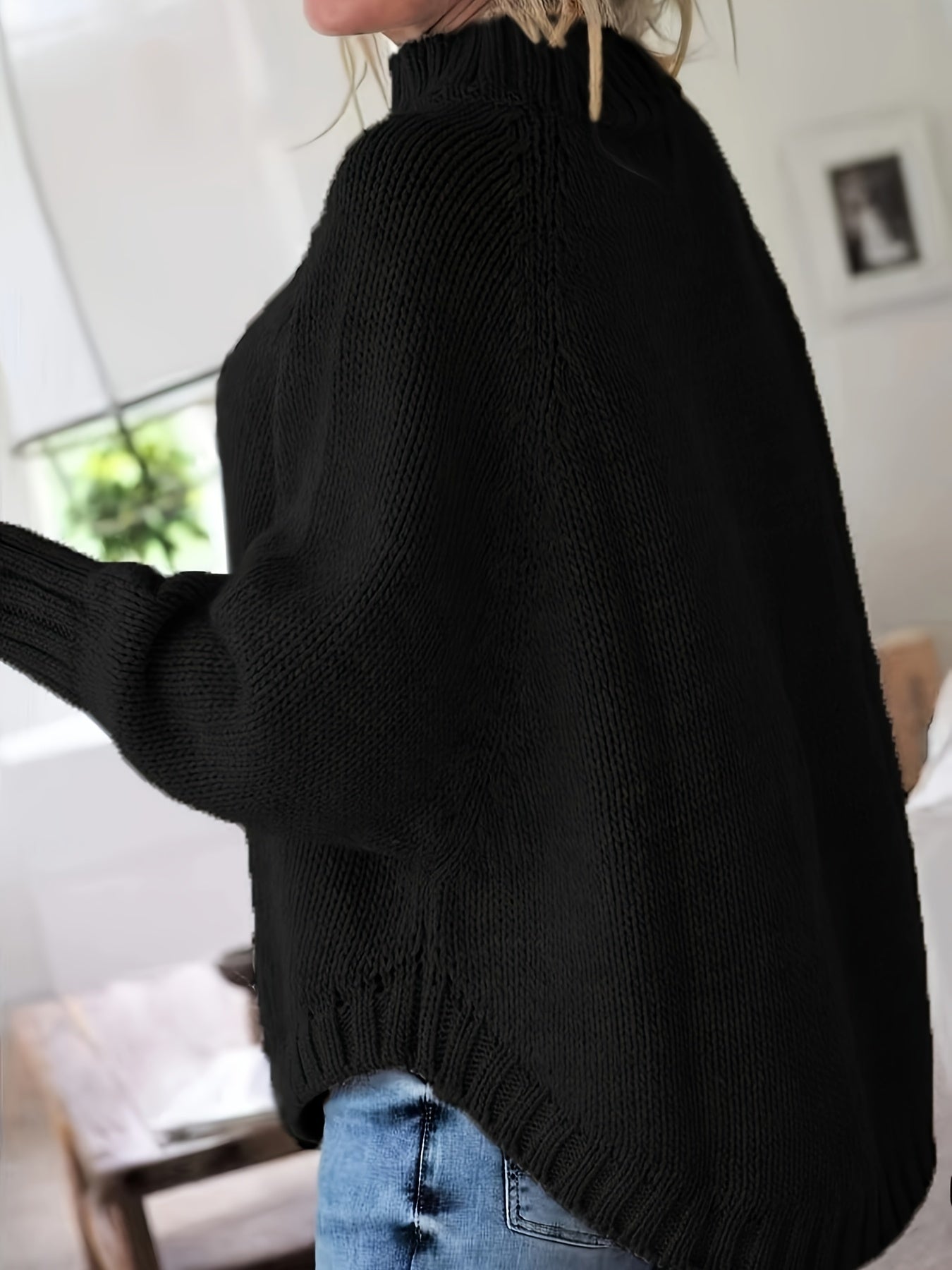 Vintage-inspired cable knit sweater with wide hem