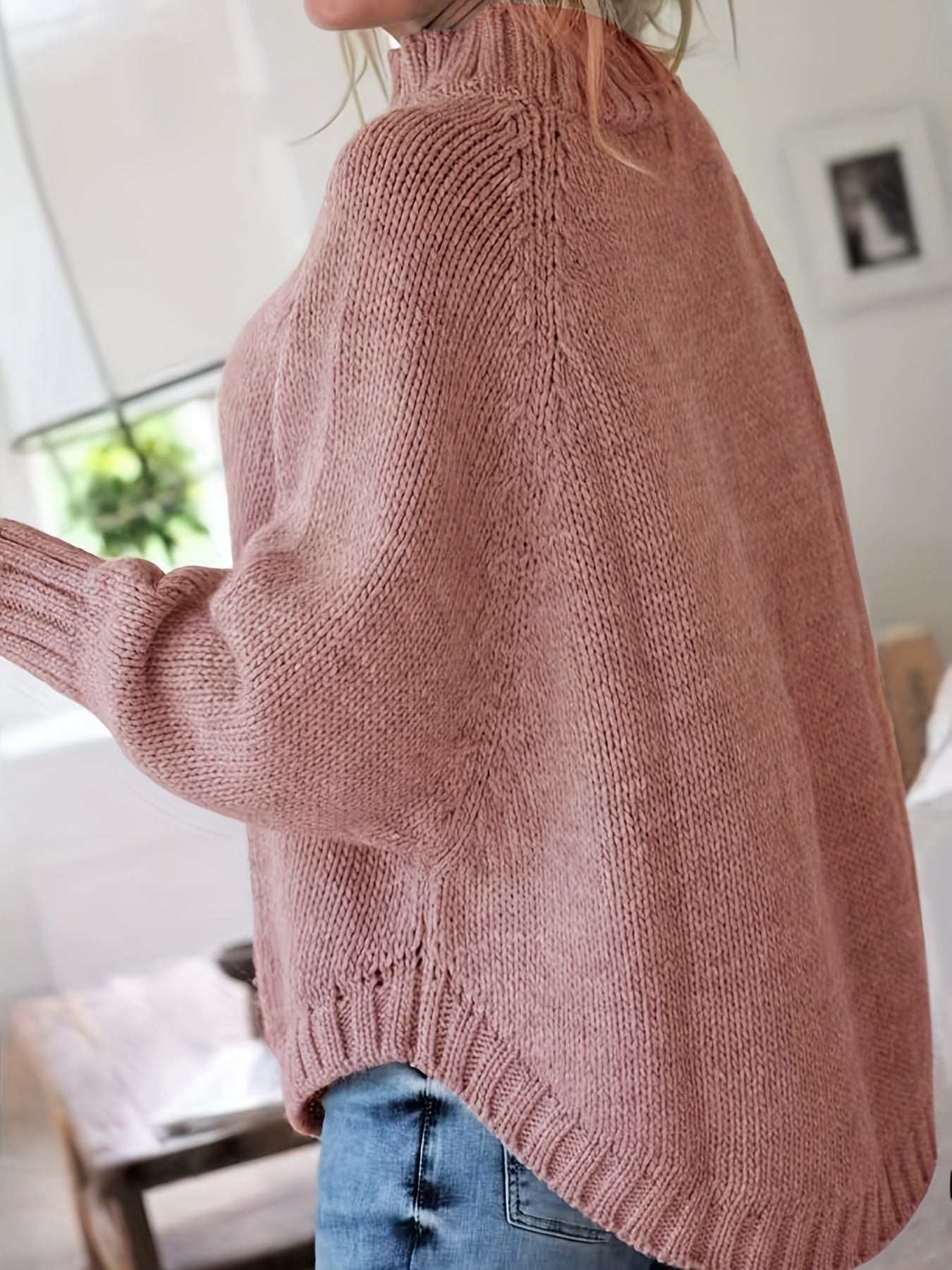 Vintage-inspired cable knit sweater with wide hem