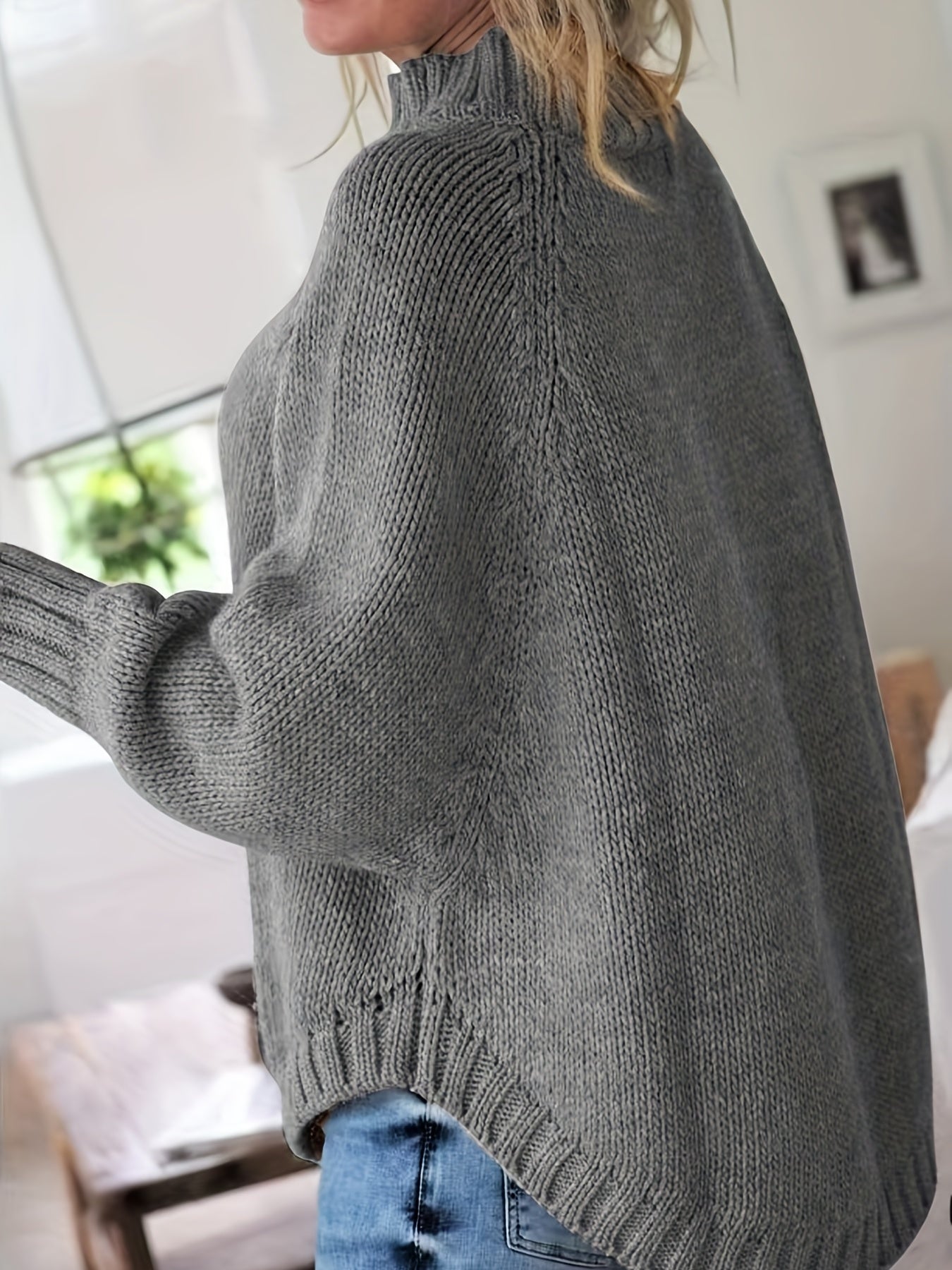 Vintage-inspired cable knit sweater with wide hem