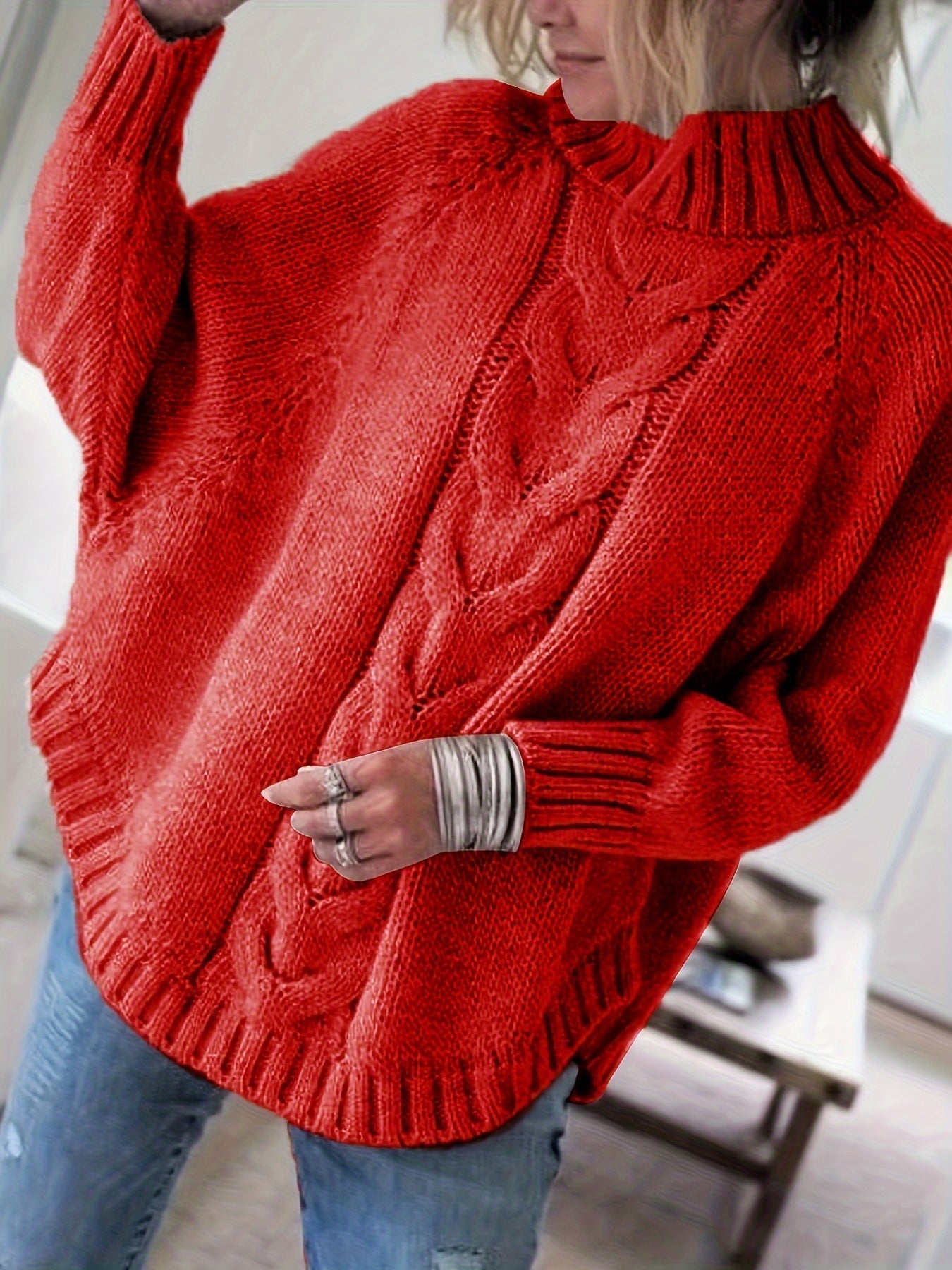 Vintage-inspired cable knit sweater with wide hem