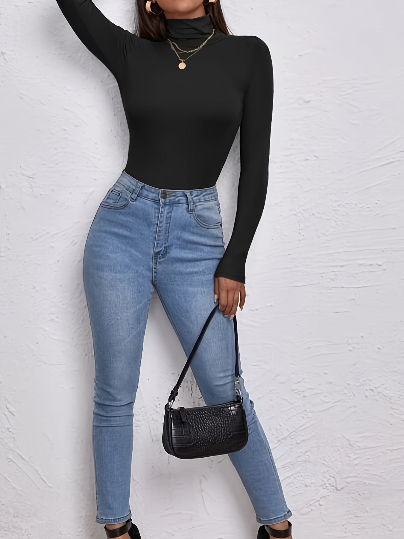 Essential layered top with a high neck and cropped silhouette