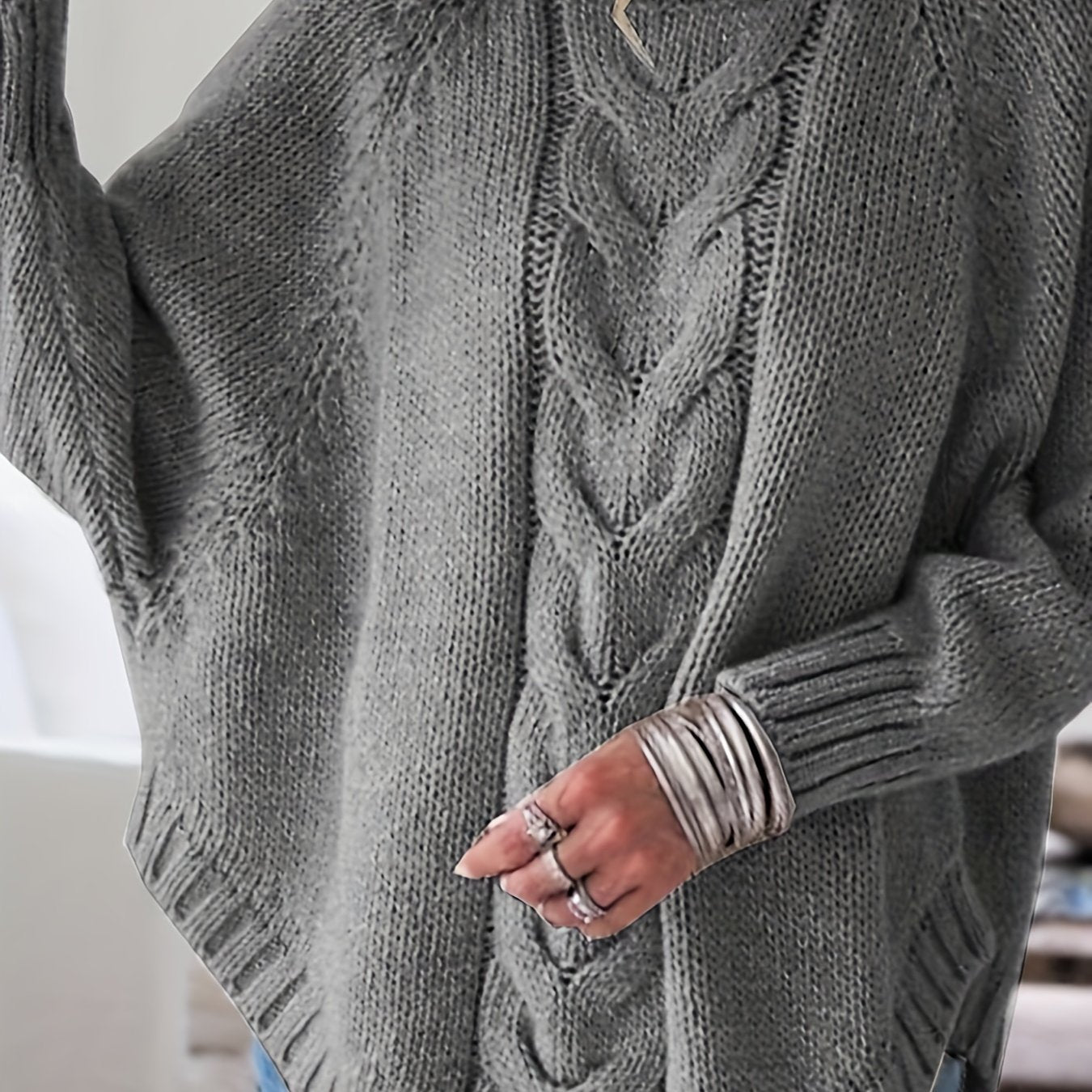 Vintage-inspired cable knit sweater with wide hem